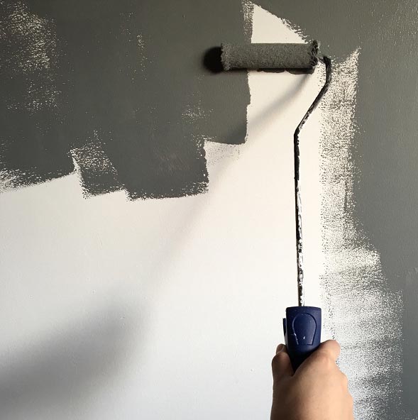 Hardest Color to Paint a Wall - Someone Painting a Wall Dark Gray