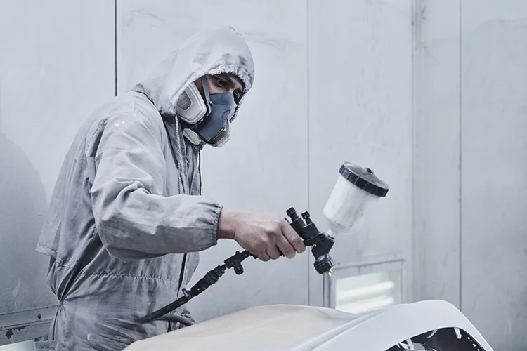 Car Mechanic Using Paint Airbrush Pulverizer